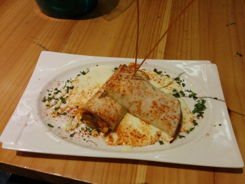 Rolls of Pasta stuffed with vegetables and chicken with cheese sauce